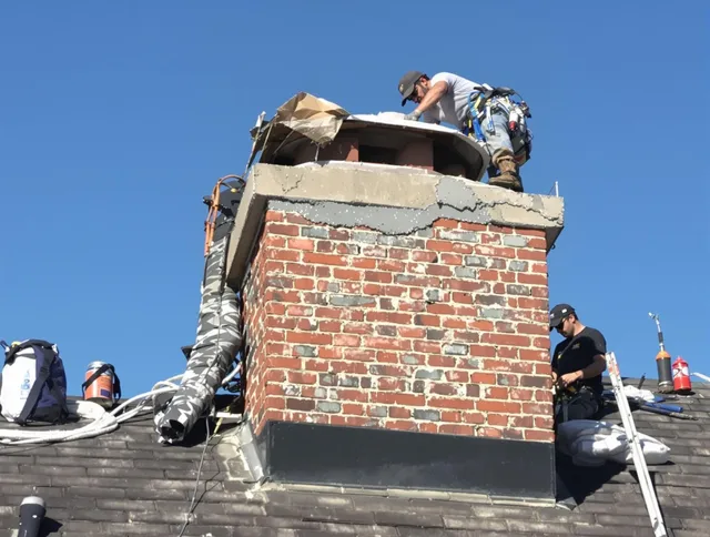 Wildomar Chimney Sweep installing a custom chimney crown in Wildomar, CA
